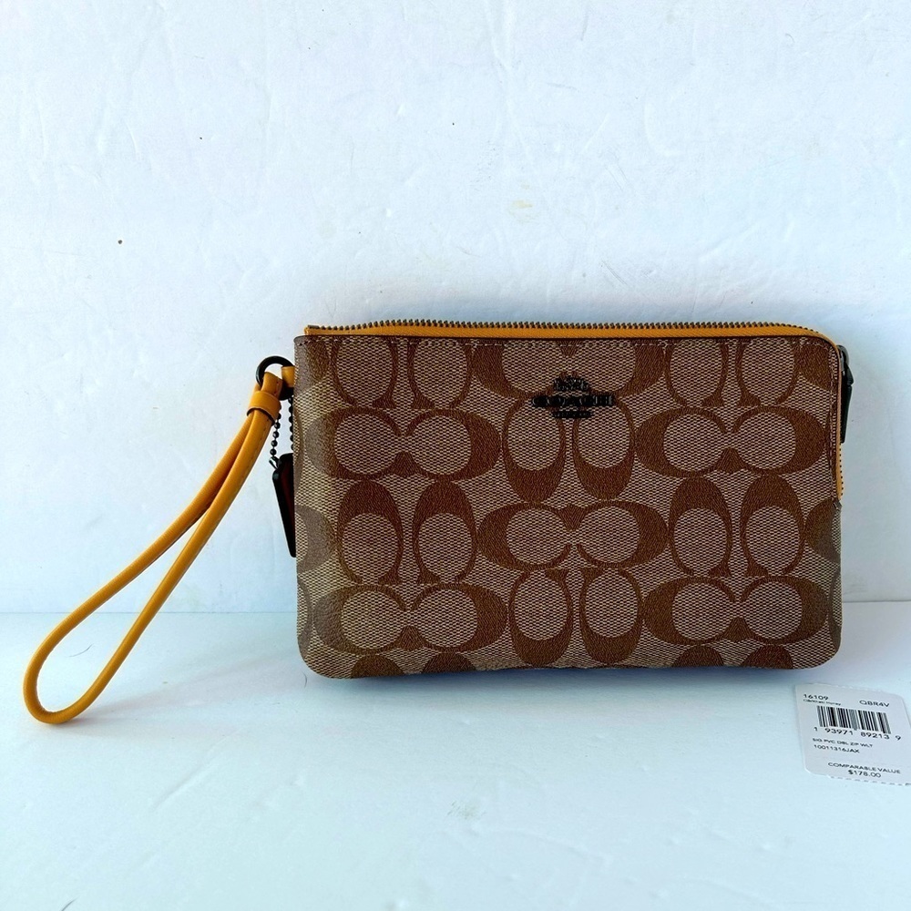 Coach NWT Wristlet Signature Print With Yellow LeatherStrap and zipper